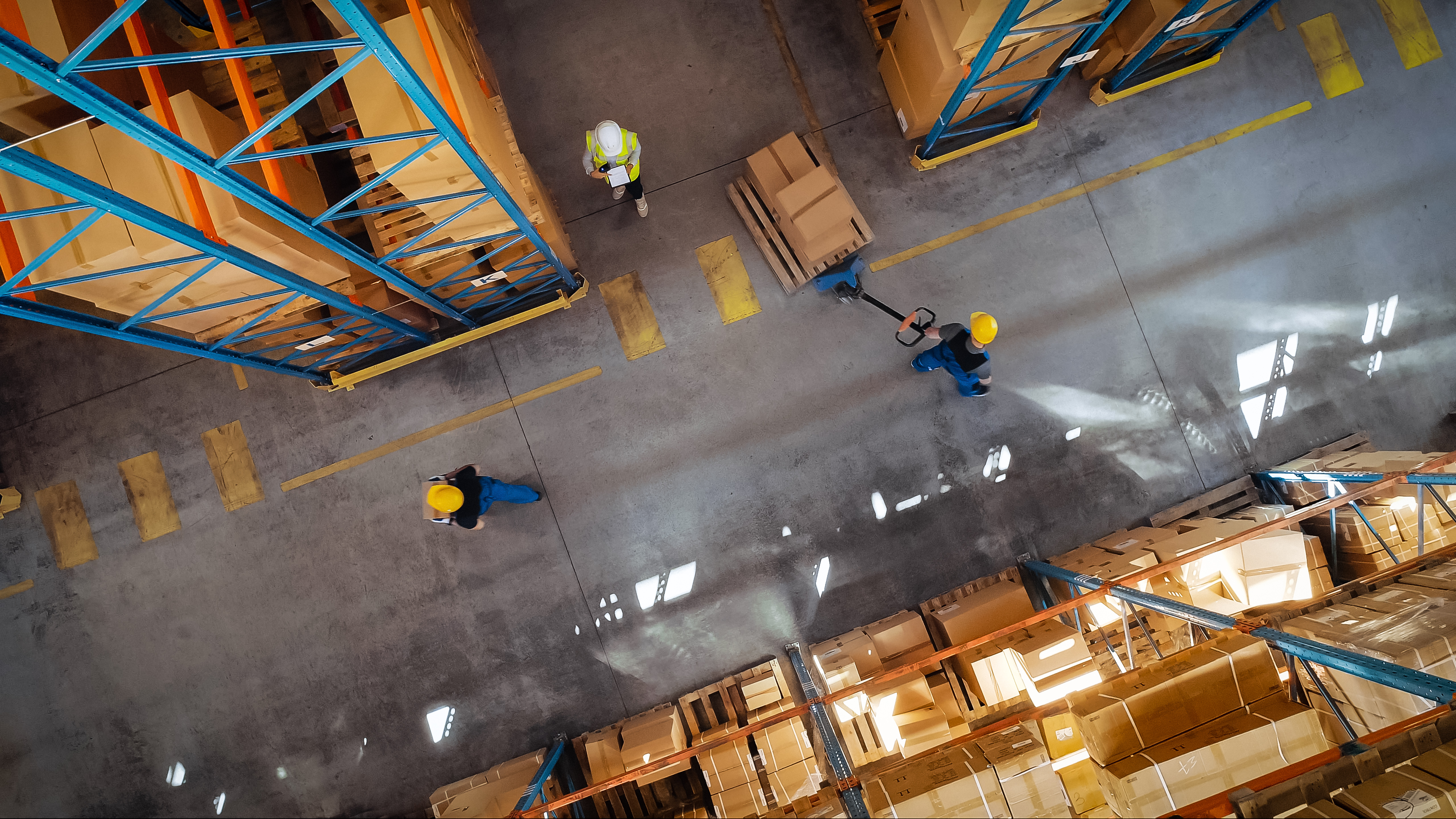 A high angle of people working in a warehouse.